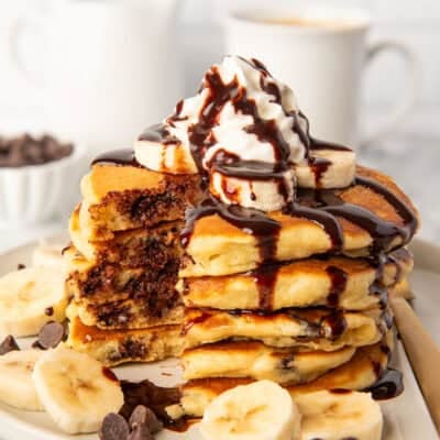 Chocolate chip pancakes with whipped cream and chocolate sauce
