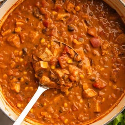 Chicken taco soup being ladled out of a pot