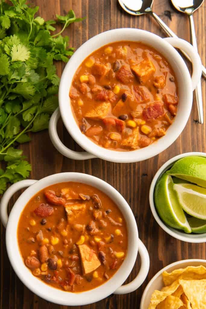 Creamy chicken taco soup in two white bowls
